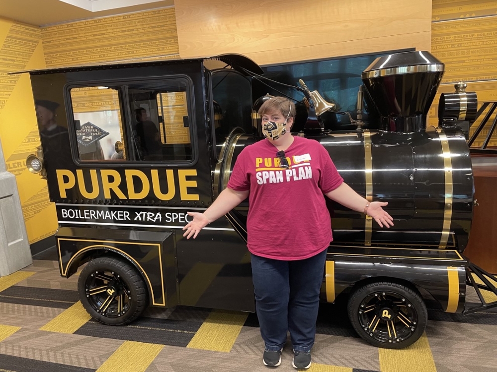 Mary Keller of Purdue Span Plan poses with the Boilermaker Extra Special Train