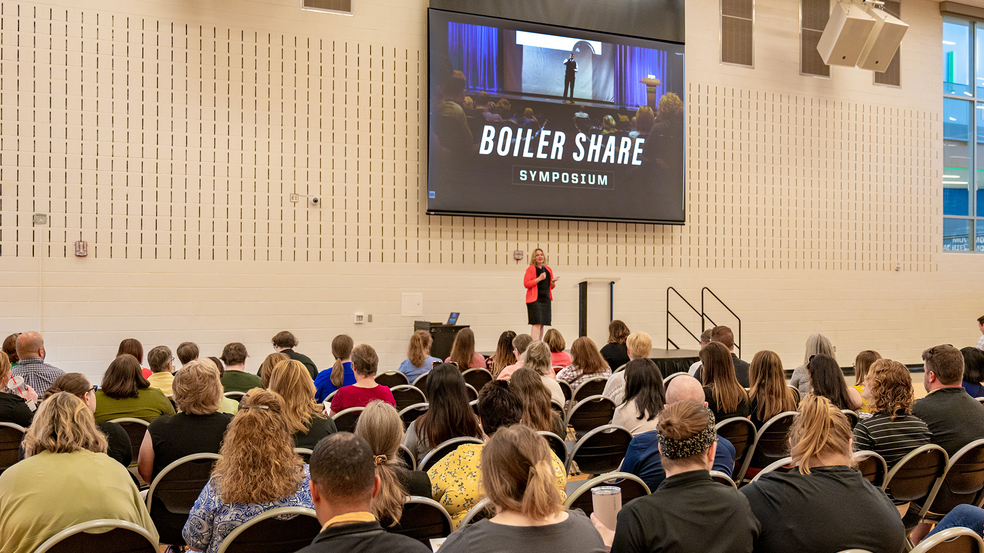 Audience looking at a speaker during the Boiler Share Symposium in the spring of 2023.
