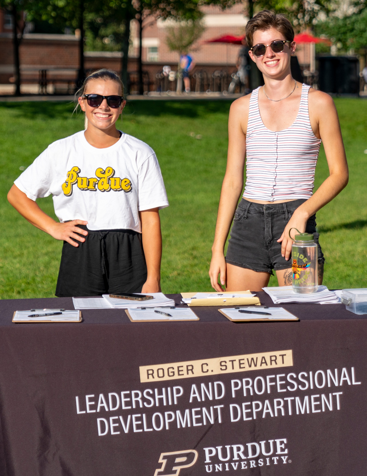 Student representatives for the Leadership Department at Purdue manning a table. 