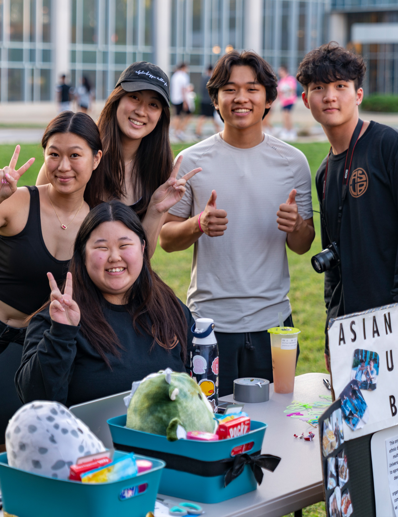 A group of students at a table for the Asian Student Union Board.