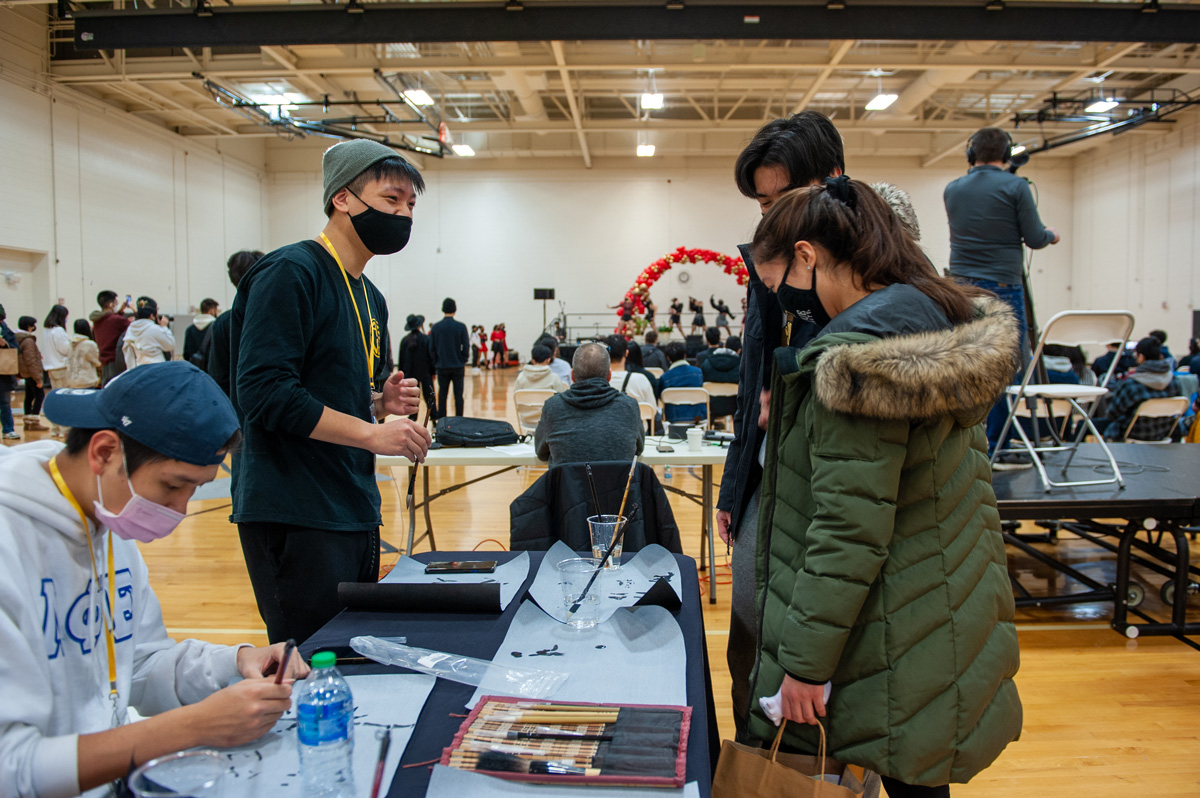 Several students talking at the Lunar New Year event in the spring of 2022.