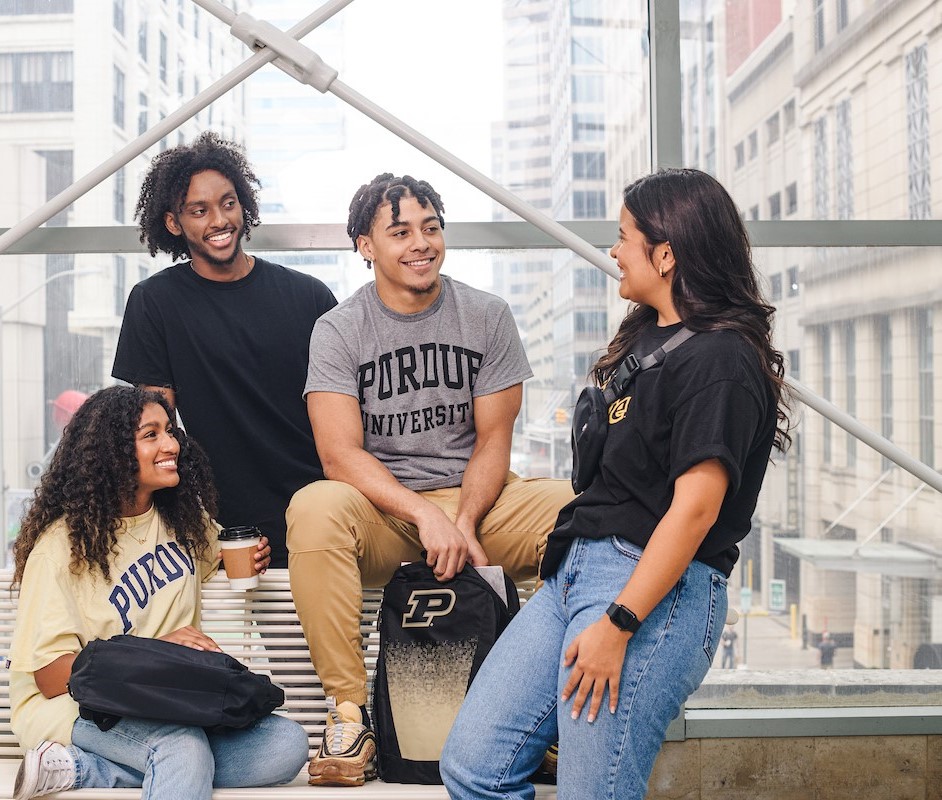 Image showing man with whiteboard marker writing, facing towards students