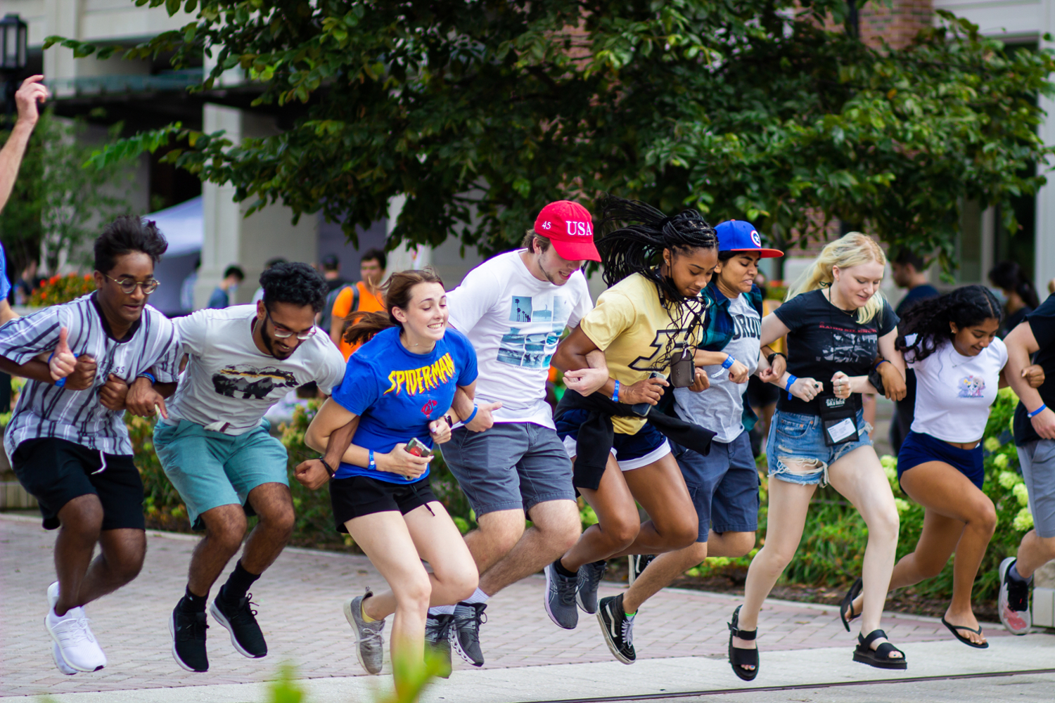 Incoming students participate in the Boiler Gold Rush tradition of jumping over the railroad tracks, signifying their entrance into Purdue University.