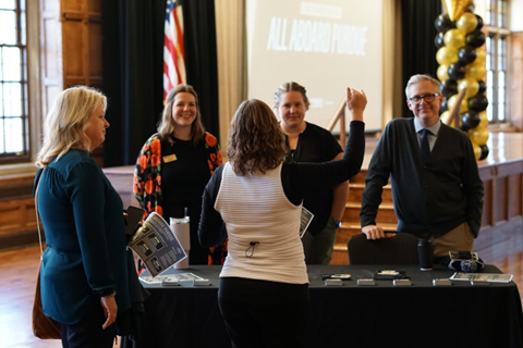 Jeff Elliott (right) joins advising staff at an All Aboard Purdue event in 2022.