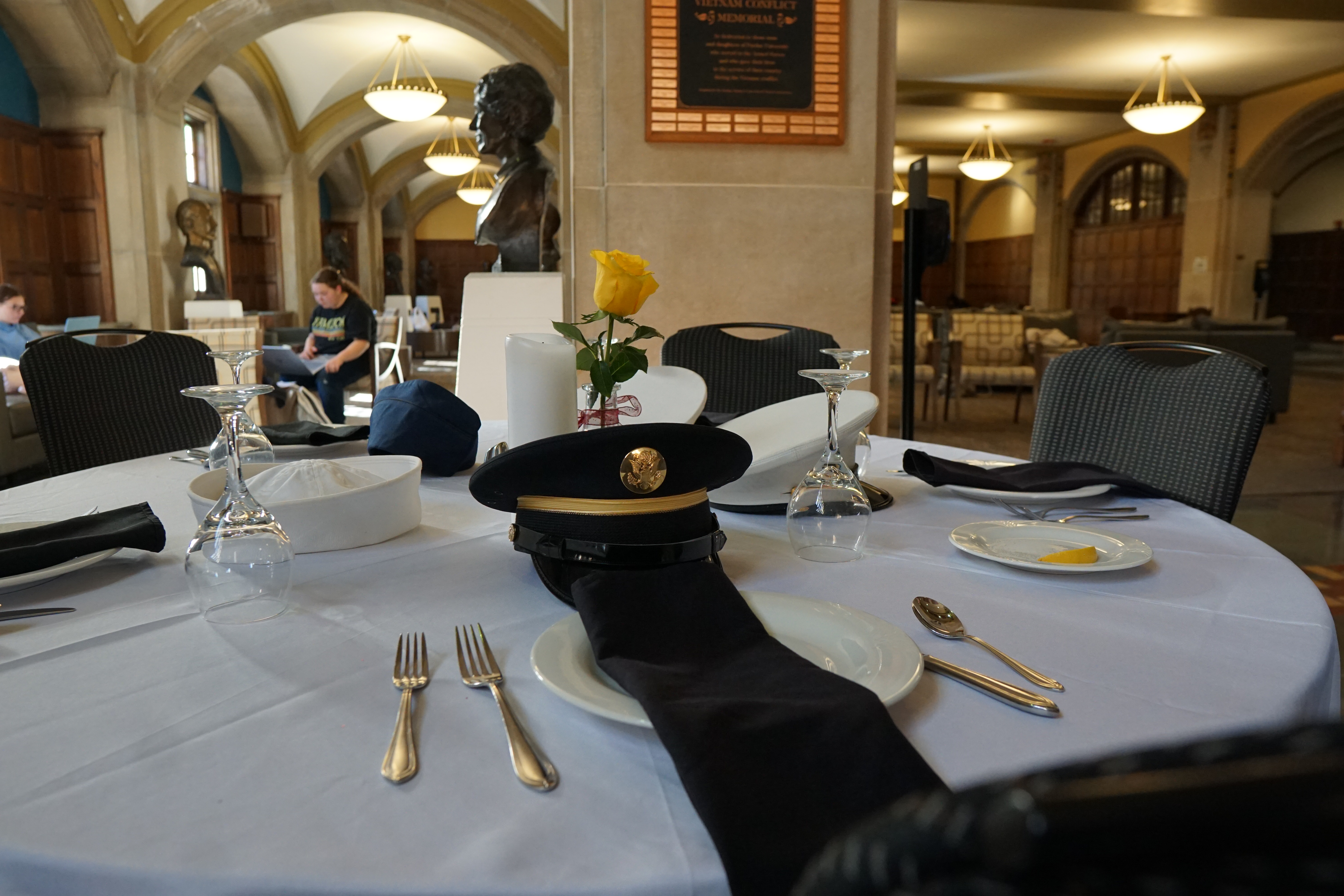 Pictured: Veterans Day celebration with members of armed services holding flags