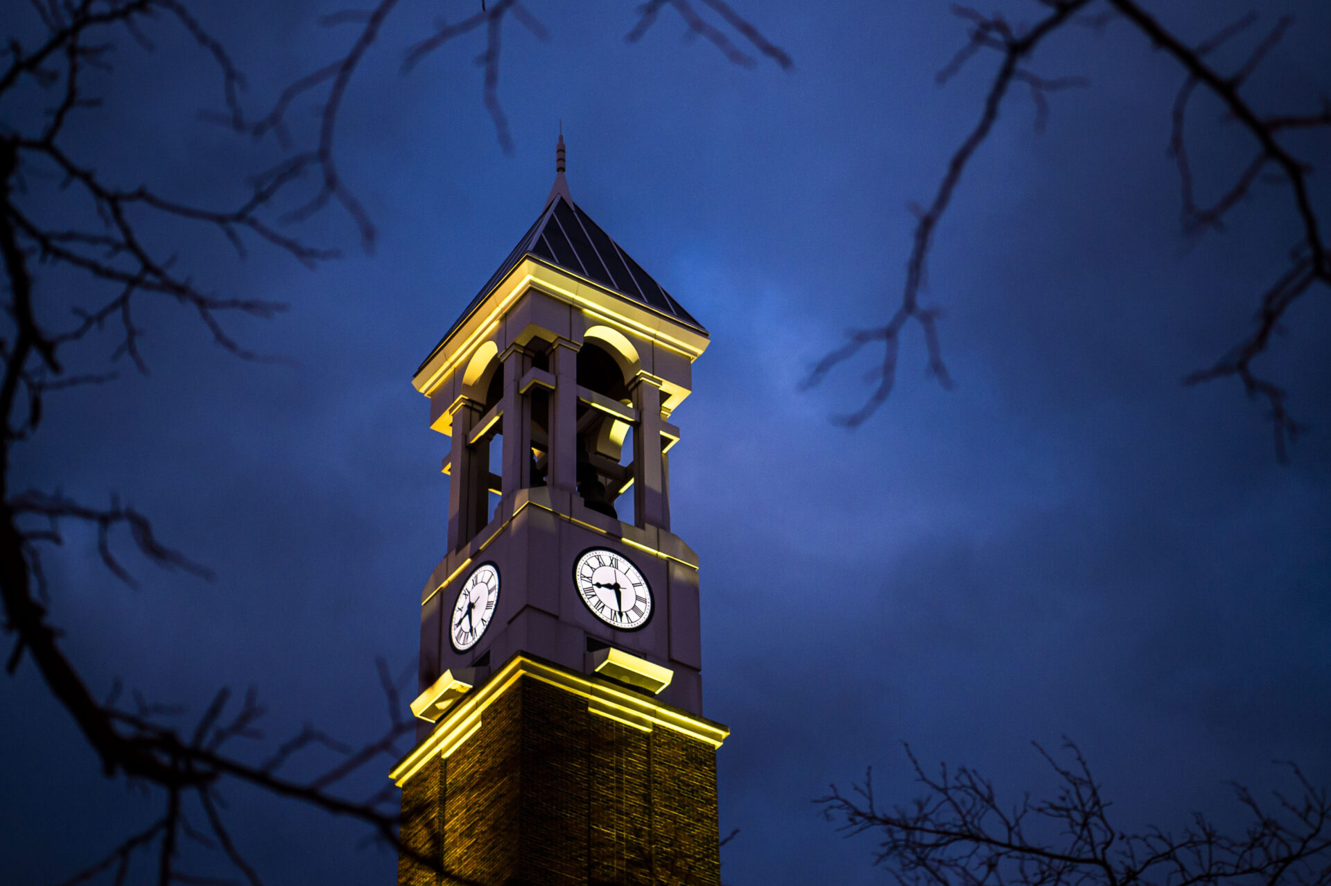 Clock tower lit at night