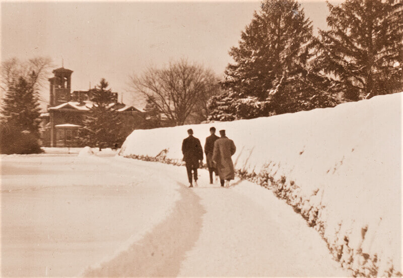 People walking through the snow on campus