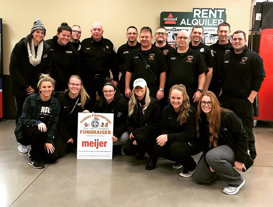 Members of Purdue University Fire Department and Purdue softball