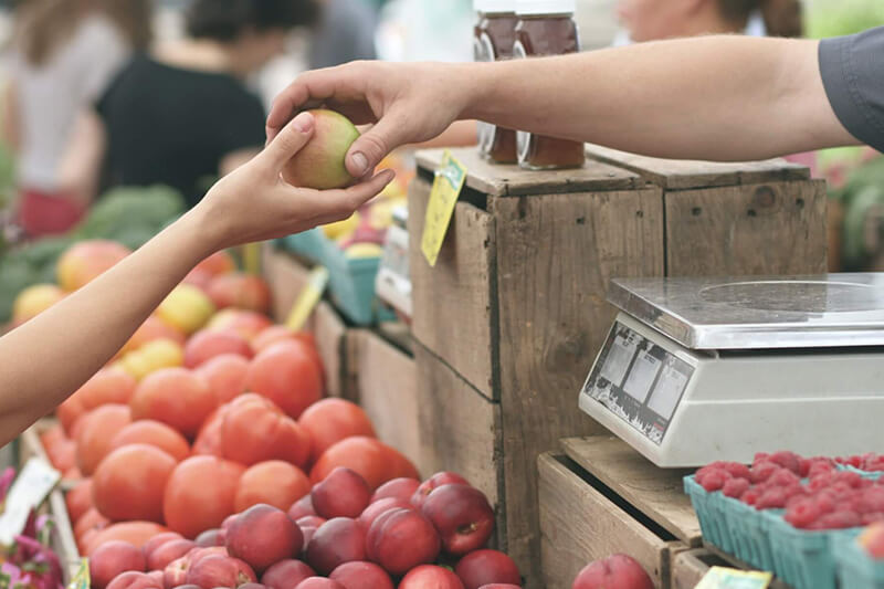 Person buying apple