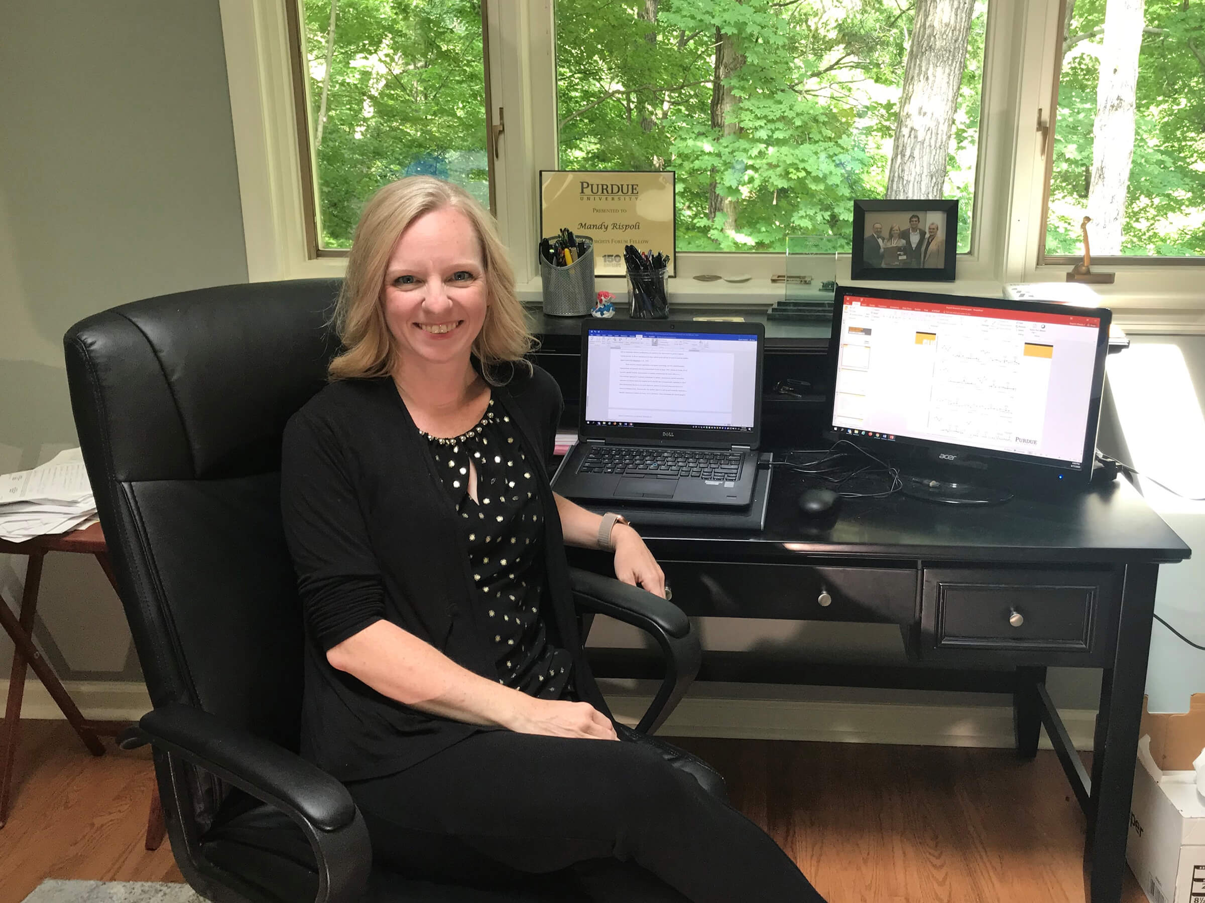 Mandy Rispoli sitting at desk