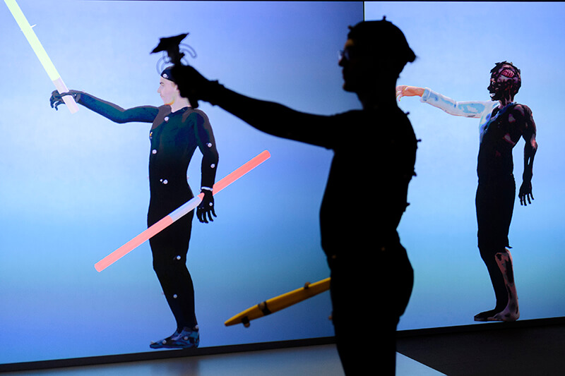 Student wearing motion capture suit