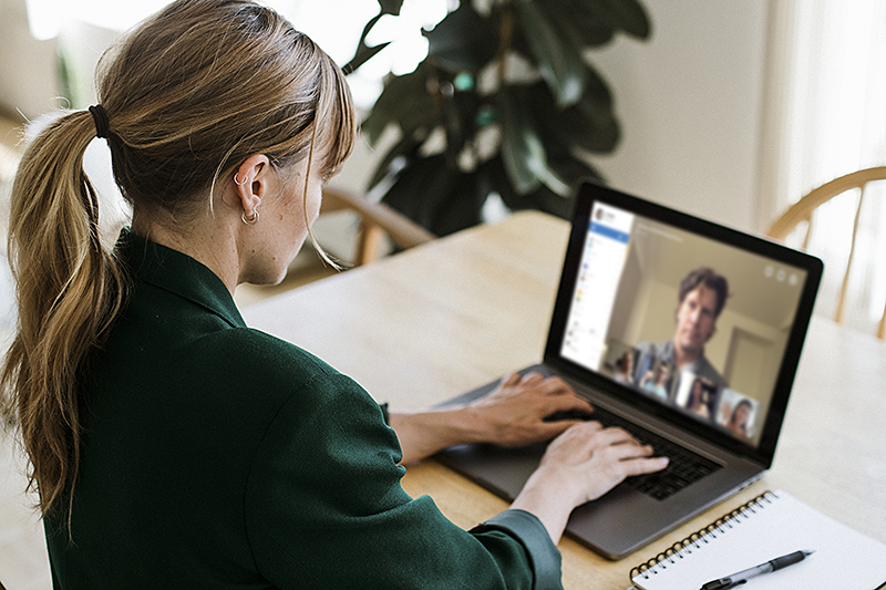 woman using laptop at table