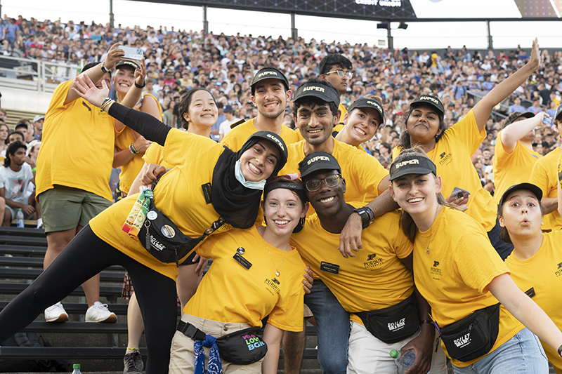 students in gold shirts in Ross-Ade stands