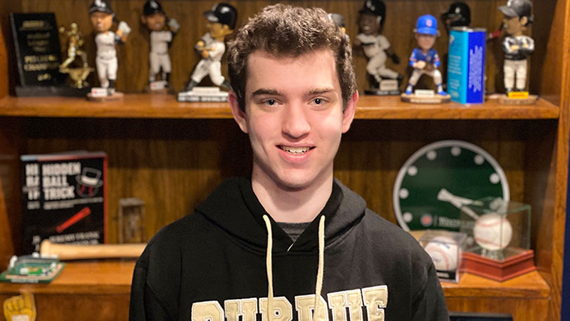 Jeremy Frank with baseball souvenirs