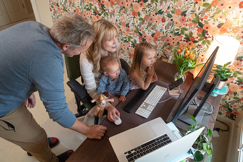 Dexter-Wiens family working and child tending at home