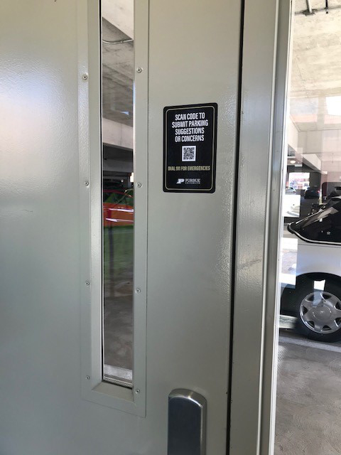 Decal with QR code on parking garage door