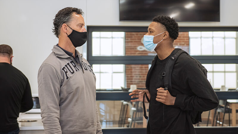 Michael Berghoff, trustees chair, speaking with PPHS student