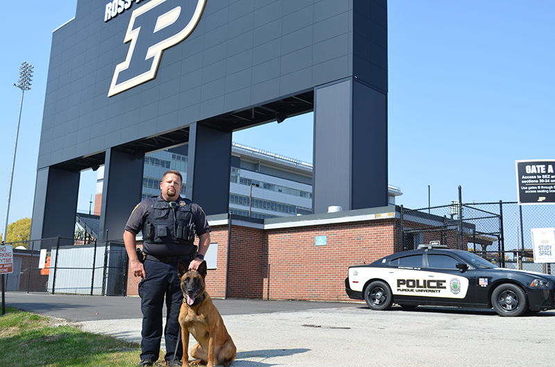 Gabe Argerbright and K-9 Aiko at stadium
