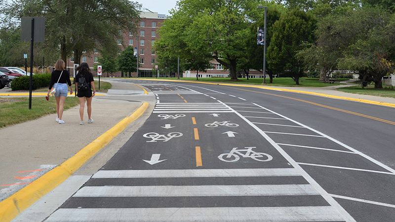 street markings; students on sidewalk