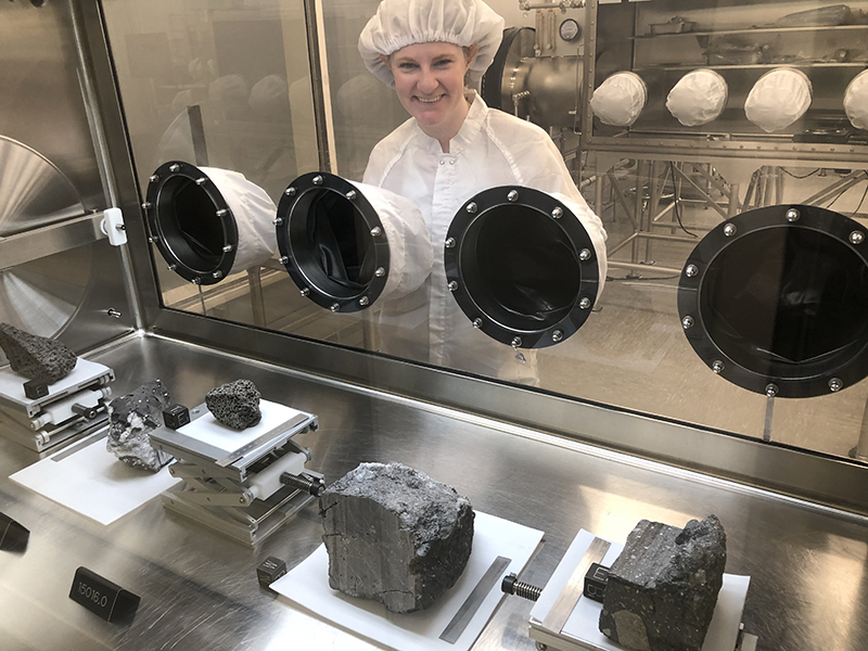 moon rocks, with Thompson behind glass