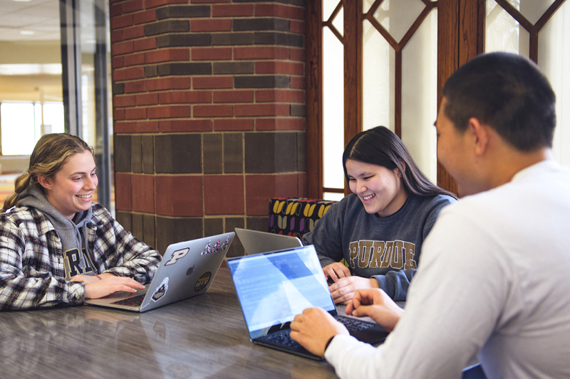 Students sitting around table