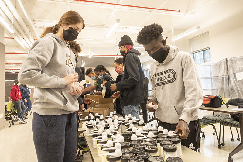 MLK day of service volunteers at supply tables