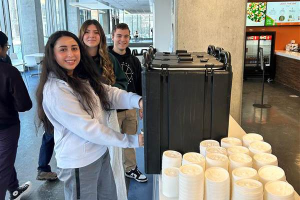 Student getting hot chocolate