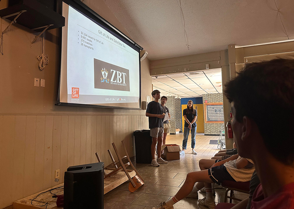 Member of Purdue's ZBT and Gift of Life give a presentation in a classroom.