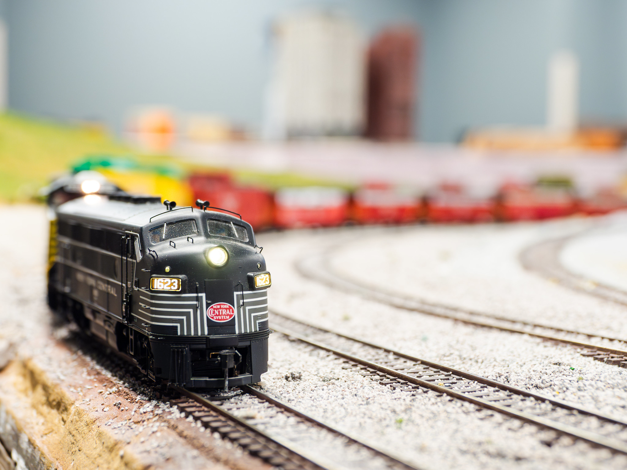 black train running on tracks 