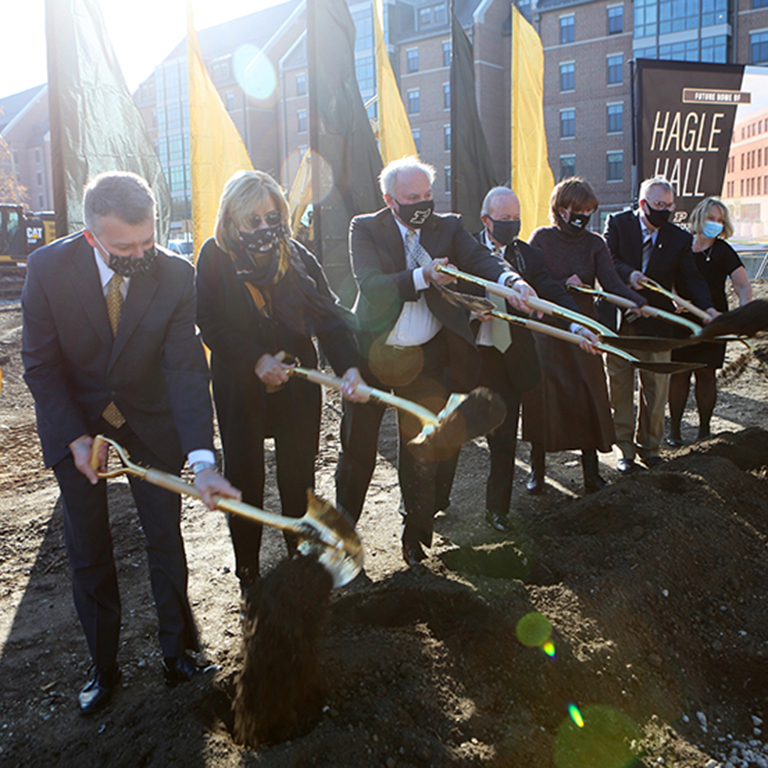 From left, Purdue Provost Jay Akridge, trustee Vanessa Castagna, Marc Hagle, President Mitch Daniels, Sharon Hagle, director of bands Jay Gephart, and Vice Provost for Student Life Beth McCuskey take part in groundbreaking ceremonies for Marc and Sharon Hagle Hall on Thursday (Nov. 12).