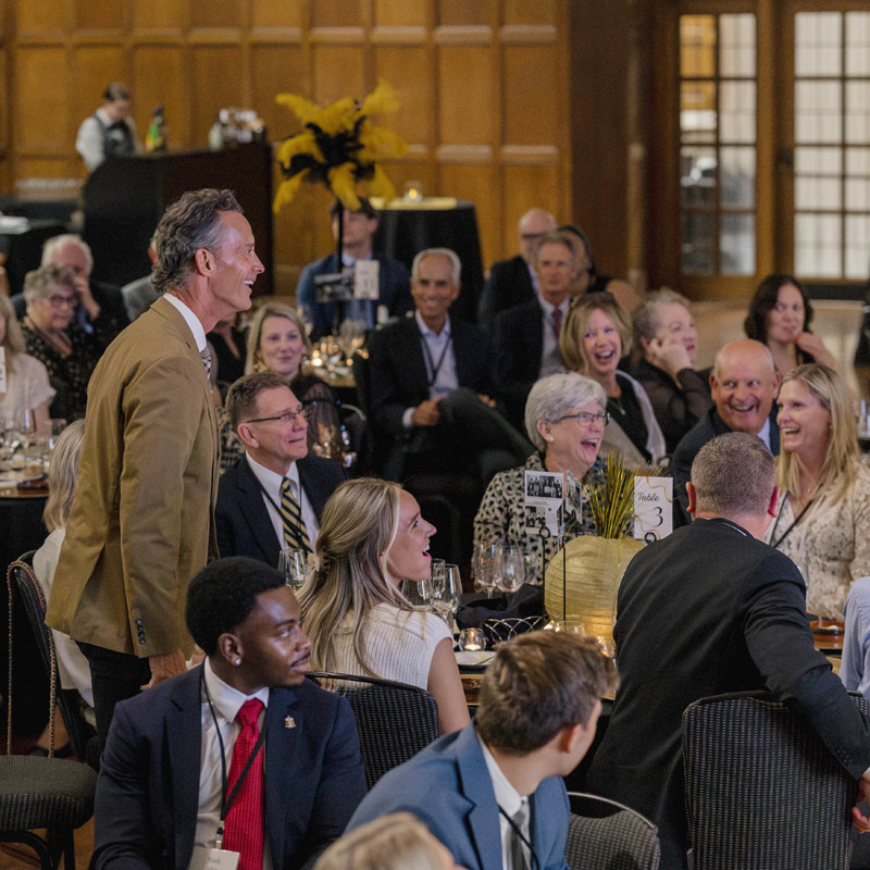 Attendees of the FSCL 150th Celebration, seated, laughing and enjoying the event