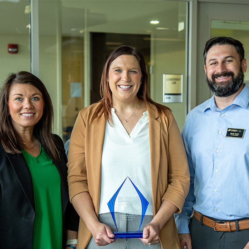 Margie Jones holding the 2025 MaPSAC Excellence Award
