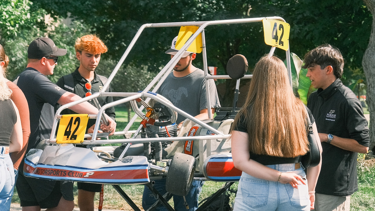 Studnets working on a Motorsports Club car