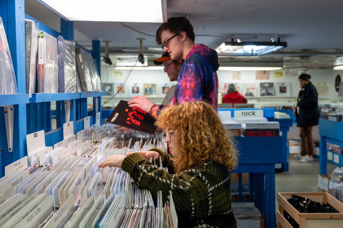 Students browsing through vinyl records.