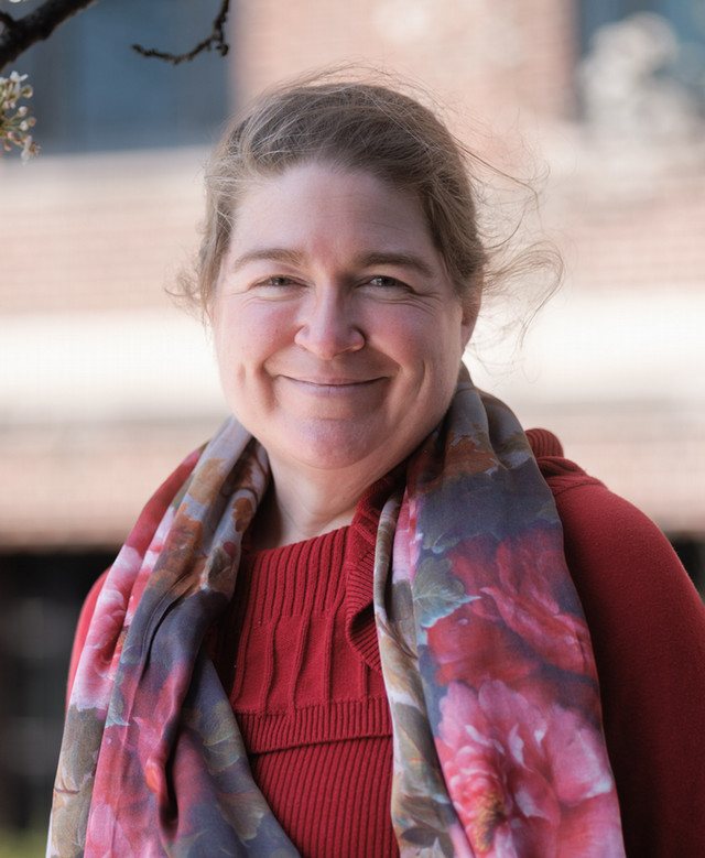 A headshot of Dr. Kris Acheson-Clair