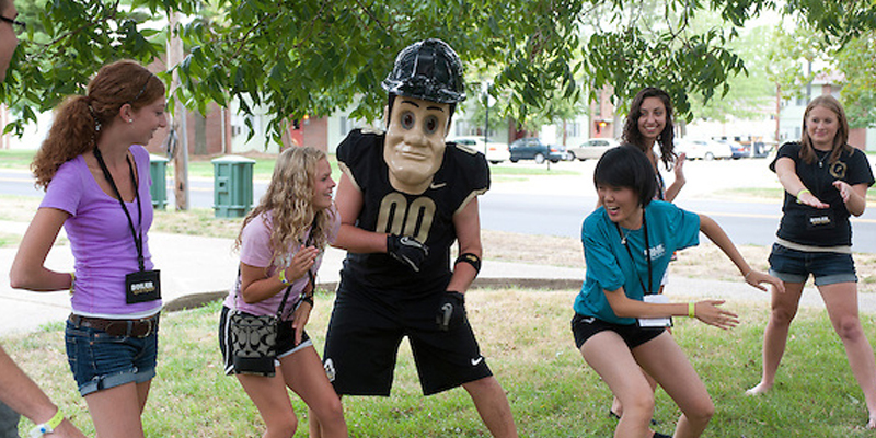Picture of Purdue Pete dancing with students during Boiler Gold Rush