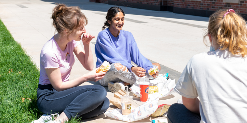 Students enjoying lunch outdoors on a Purdue Reading Day.